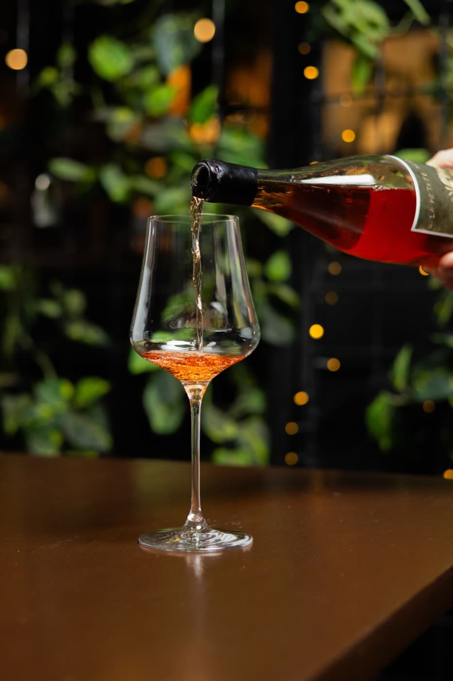 Wine being poured into a glass at Wine & Larder